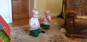 The twins on the living room floor.