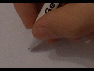 Animation of a hand using a pen to write a name, "hello", and a scribble.
