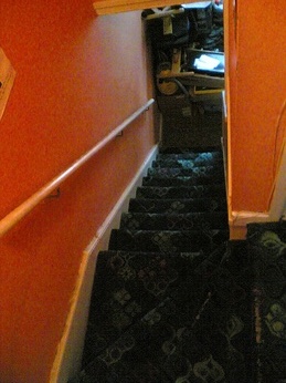 Tidy stairwell up to The Flat
