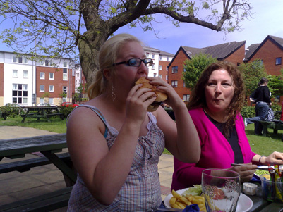 Becky stuffing a huge burger down her face hole