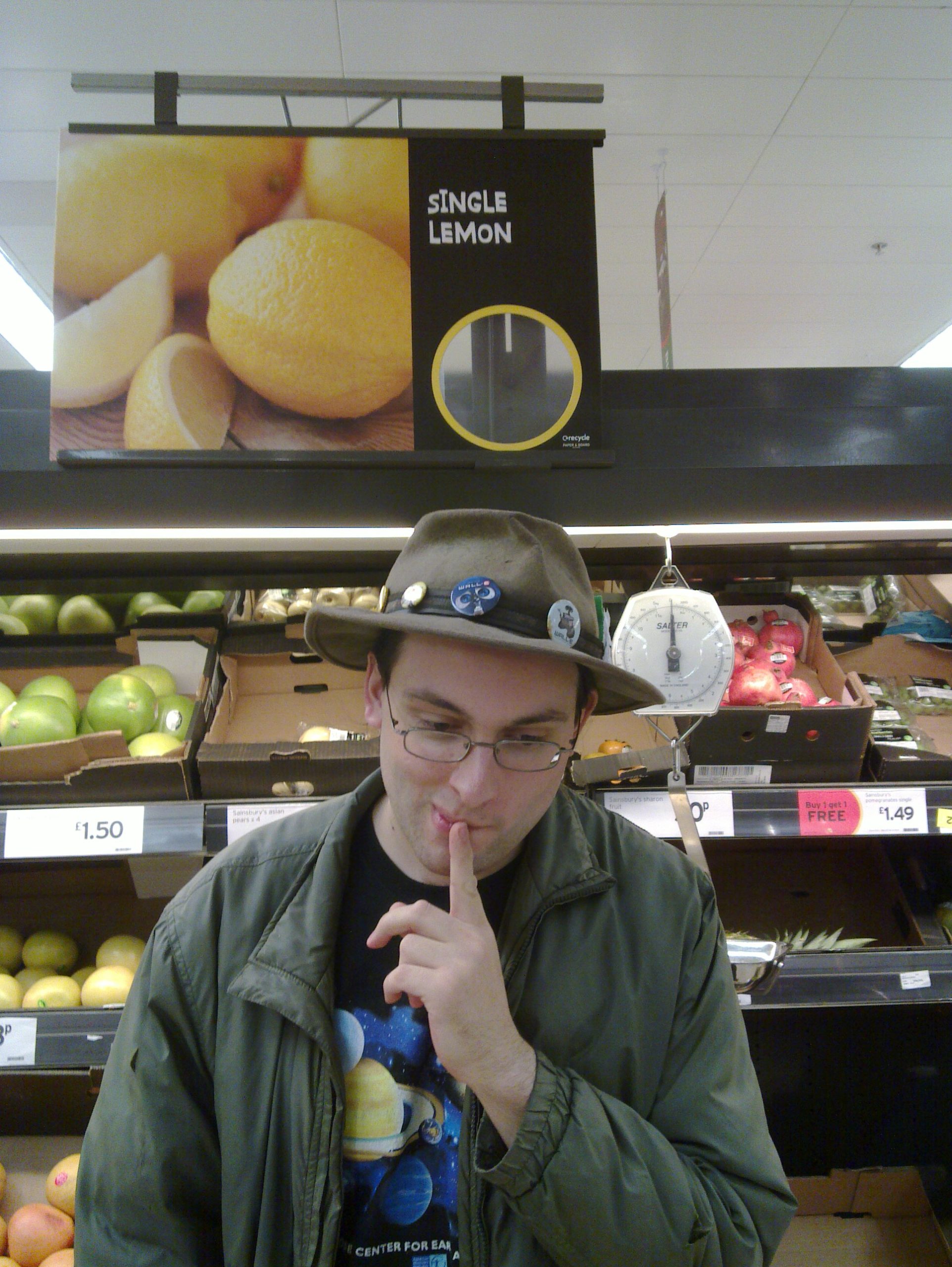 Paul in a supermarket under a sign that reads "Single Lemons".