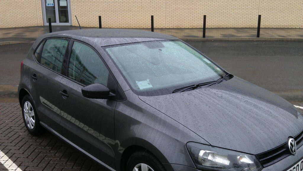 Golf "Eulalia", one of the Oxford Streetcar/Zipcar vehicles, seen here parked at Aylesbury College.