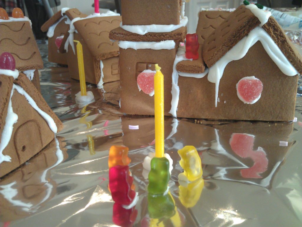 Gummy-bear citizens gather around a candle lamp-post in the gingerbread village. Little do they know of the horror that approaches...