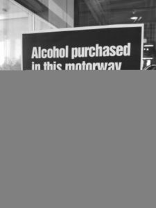 Sign: "Alcohol purchases in this motorway service area can not be consumed inside or outside the premises."