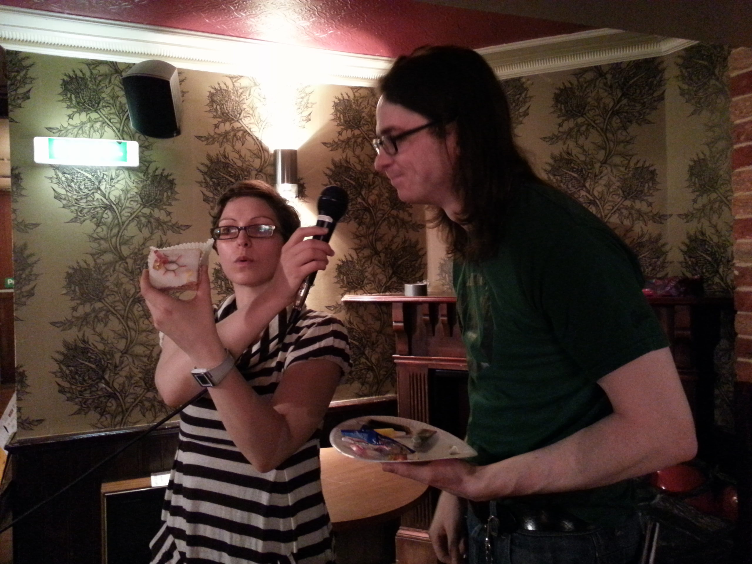 Matt R with Helen Arney of Domestic Science, explaining why he's drawn a silicon lattice onto an iced bun.