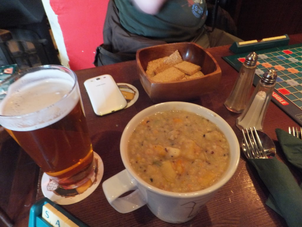 (Veggie) haggis stovie (in a mug), a bowl of oatcakes, and a pint of beer.
