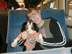 My sister Becky with Puddles, on a train.