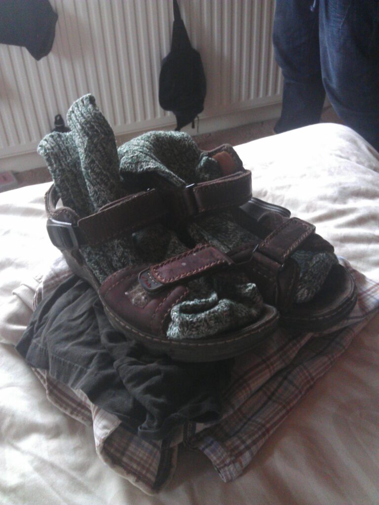 My dad's clothes for his funeral. My sisters and I decided that he ought to be dressed as he would be for a one of his summer hikes, right down to the combination of sandals and socks (the funeral director needed reassurance that yes, he really did routinely wear both at the same time).