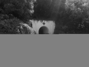 The main entrance to the Jersey War Tunnels: a tunnel cut directly into the mountainside, painted as a hospital entrance.