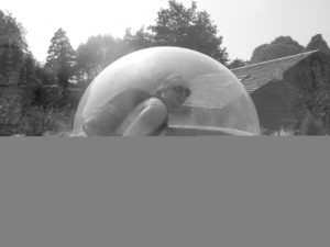 Ruth under a dome in a meerkat enclosure.