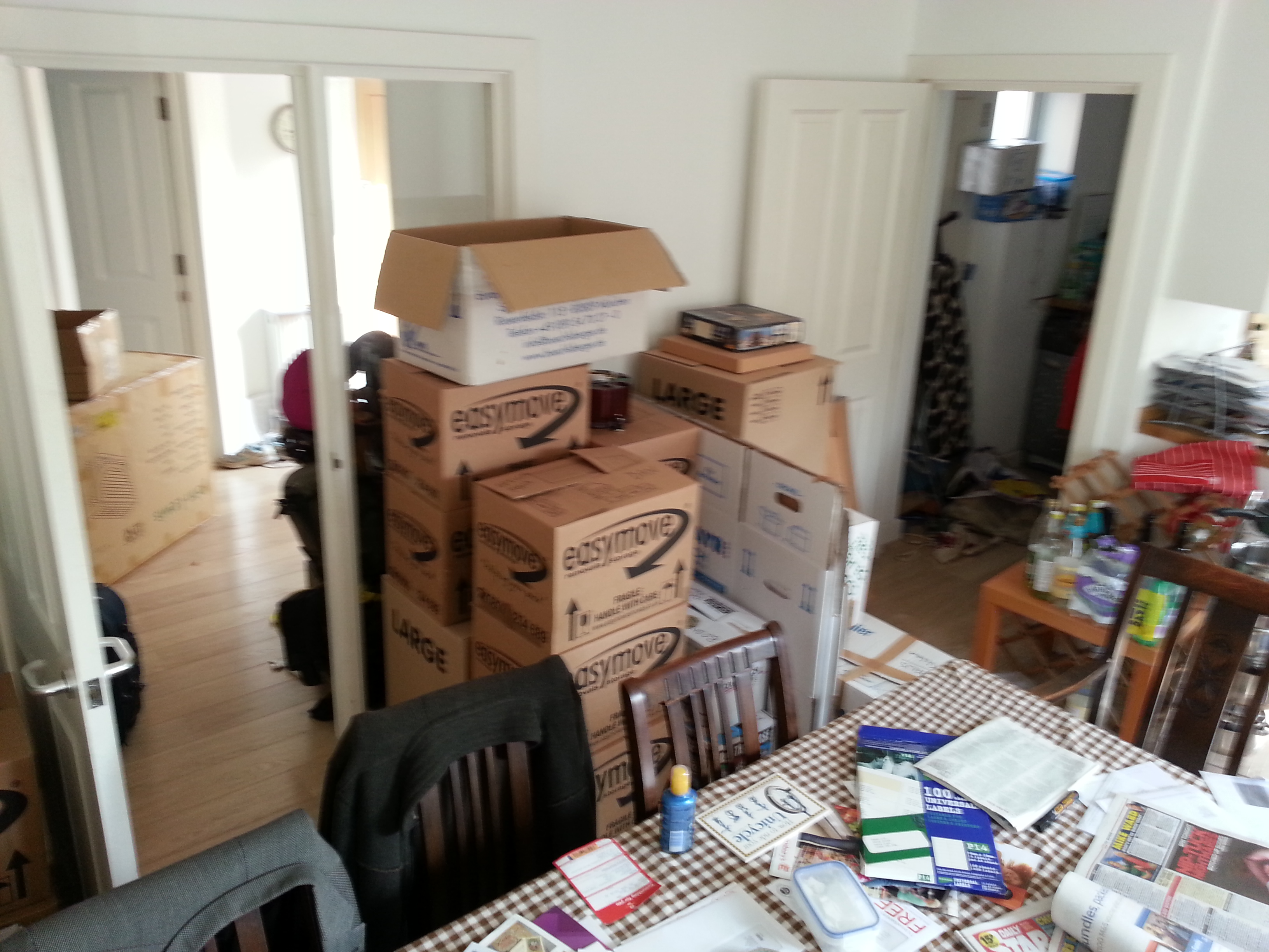 Piles of boxes - mostly full of board games! - at our old house.