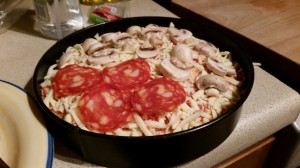 Pizza cake ready to go into the oven.