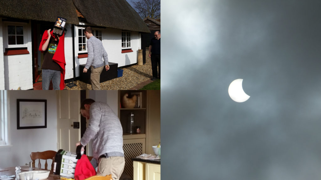 A developer hides inside a handmade camera obscura to watch the solar eclipse at DevCamp 2015.