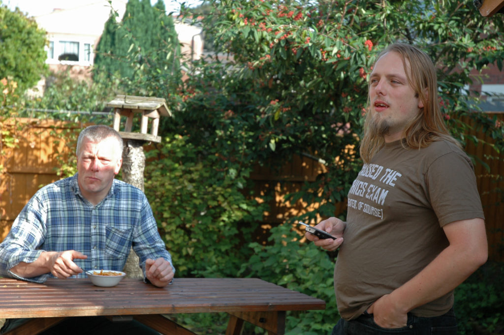 Dan and his dad have breakfast in the garden.