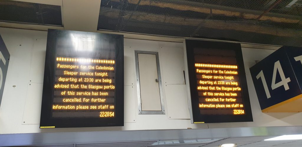 Digital display board: "Passengers for the Caledonian Sleeper service tonight departing at 23:30 are being advised that the Glasgow portio [sic] of this service has been cancelled. For further information please see staff on"