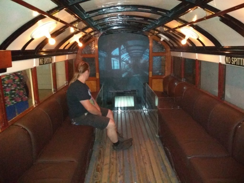 Dan sits aboard a replica of an original Glasgow subway train.