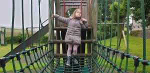 Annabel on the climbing frame.