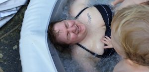 Becky is harassed in the hot tub.