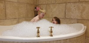 John and Annabel in a very bubbly bath.