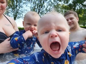 The twins, excited, in the hot tub.