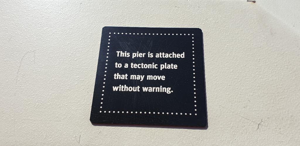 Sign: This pier is attached to a techtonic plate that may move without warning.