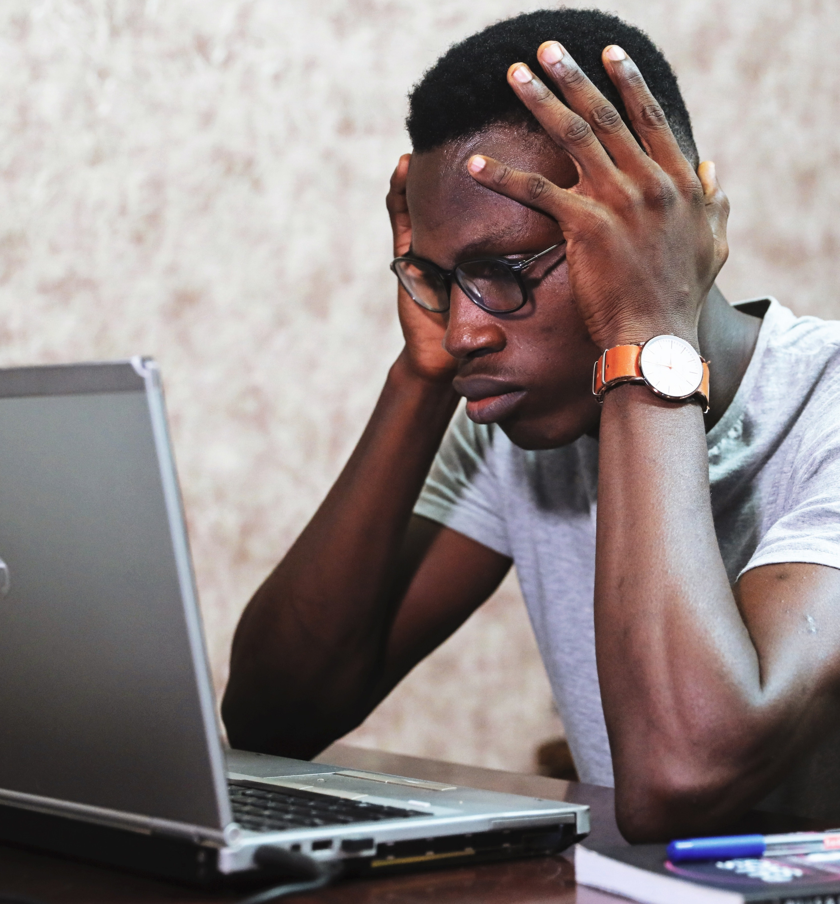 Man staring intently at laptop. Image courtesy Oladimeji Ajegbile, via Pexels.