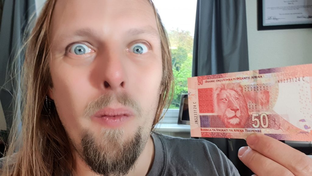 Dan with a 50 South African Rand note.