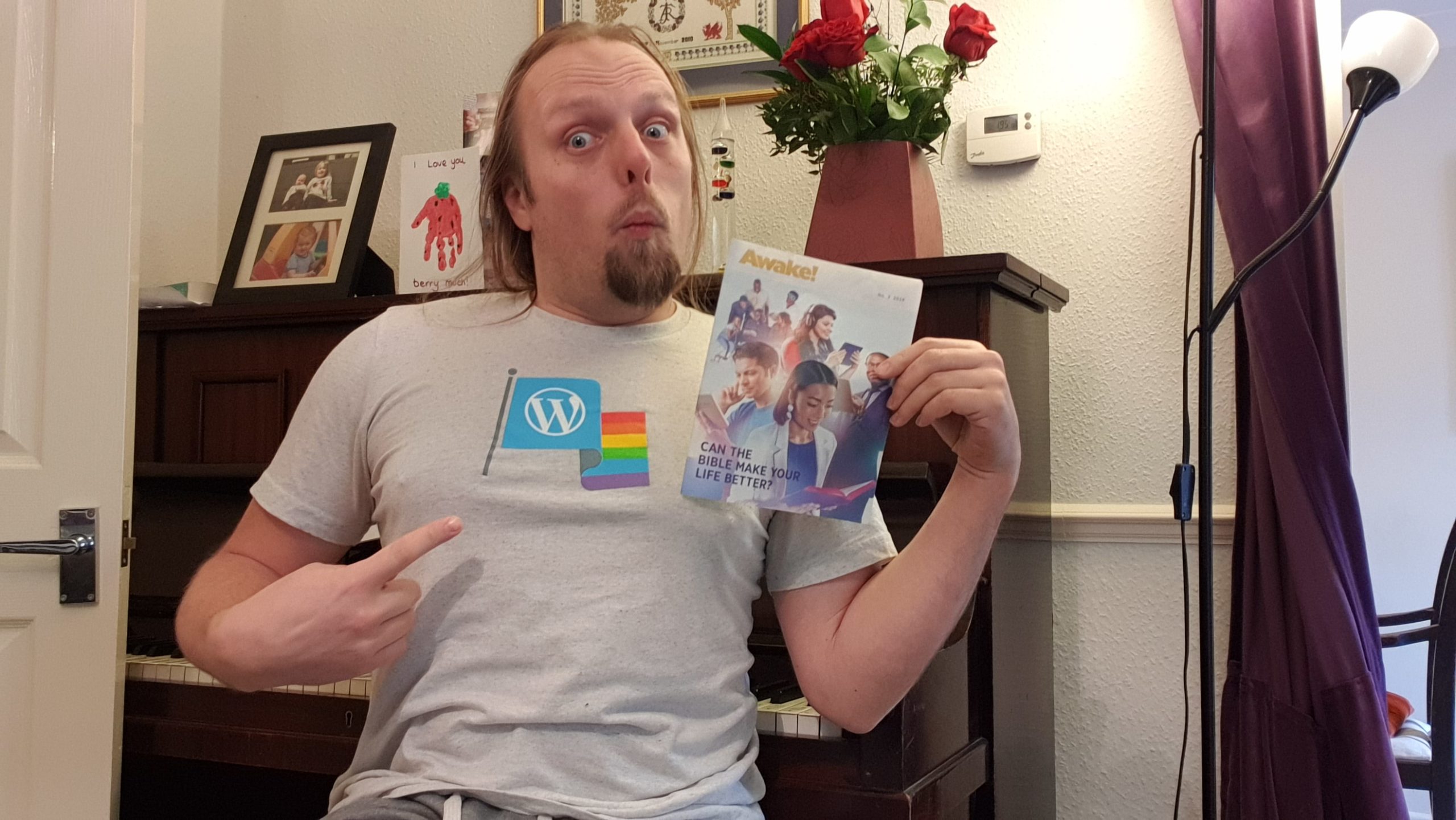 Dan with a copy of Awake!, wearing his WordPress Diversity t-shirt.