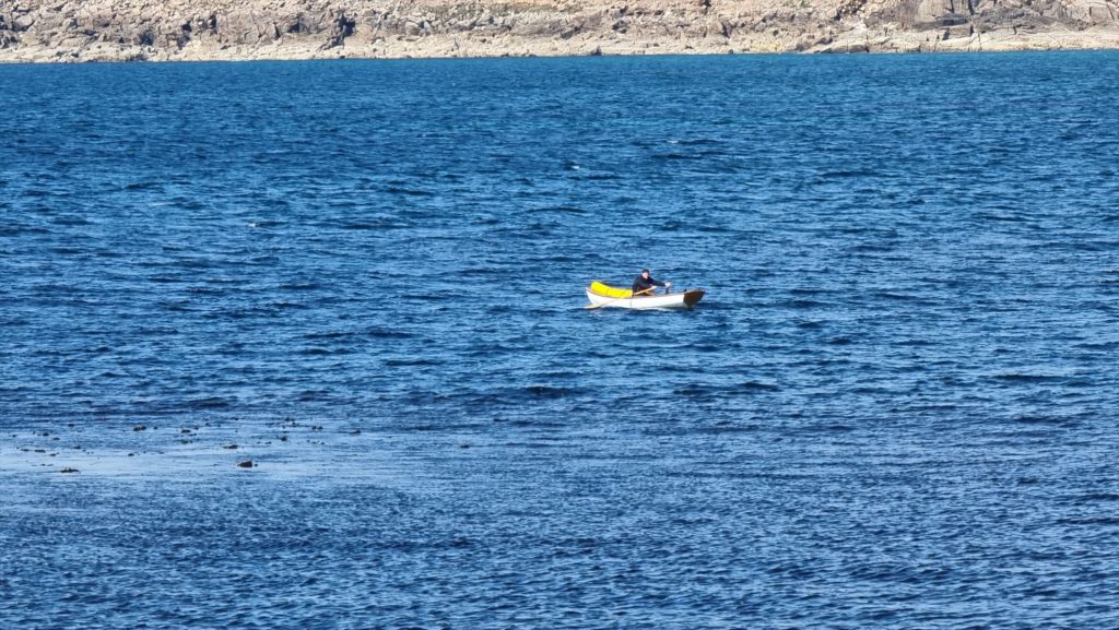 Robin rows away from Sennen Cove and towards St. Ives