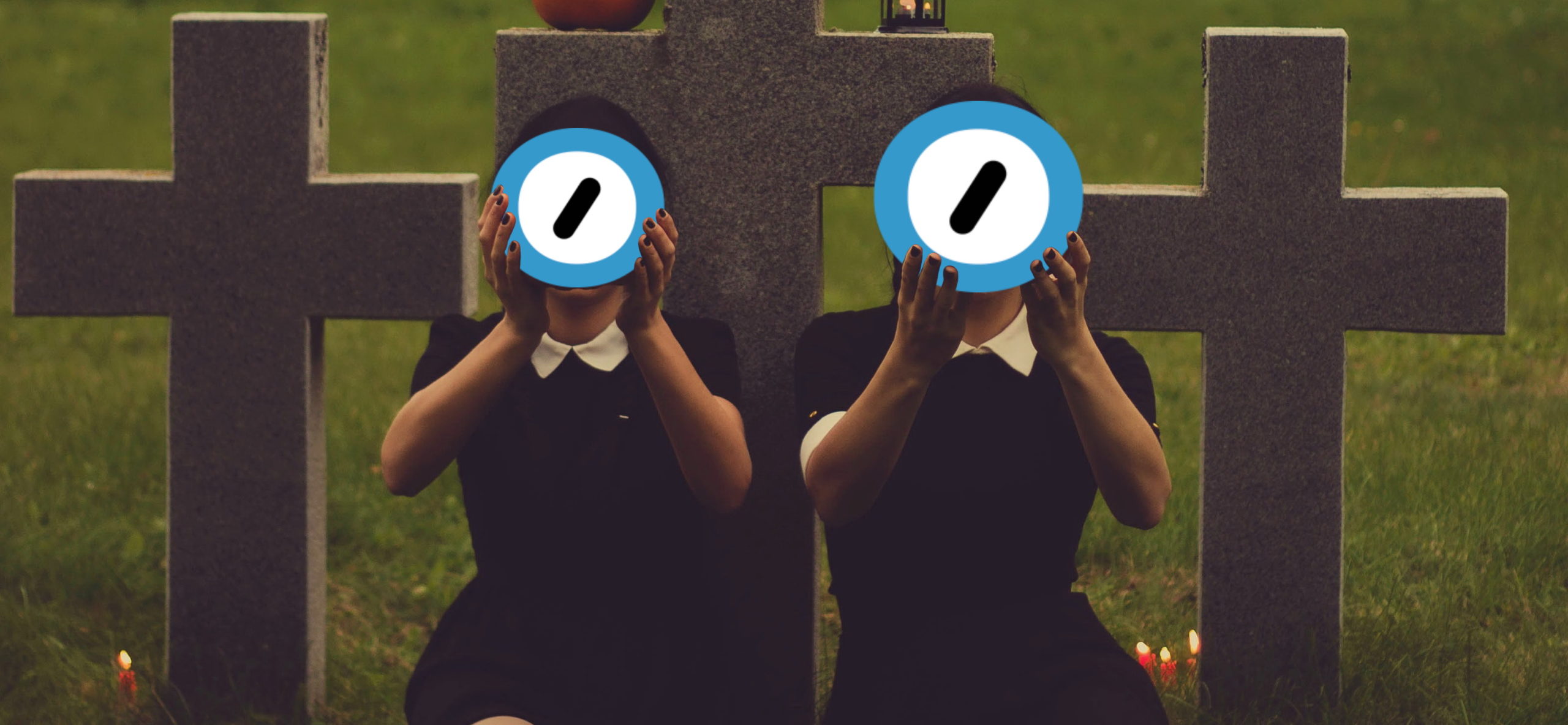 Two women in black dresses sit in a graveyard by candlelight and hold up the Automattic logo. Edited image based on original photo by Valeria Boltneva from Pexels (used with permission) and the Automattic logo (used under the assumption that they won't mind, given the context).