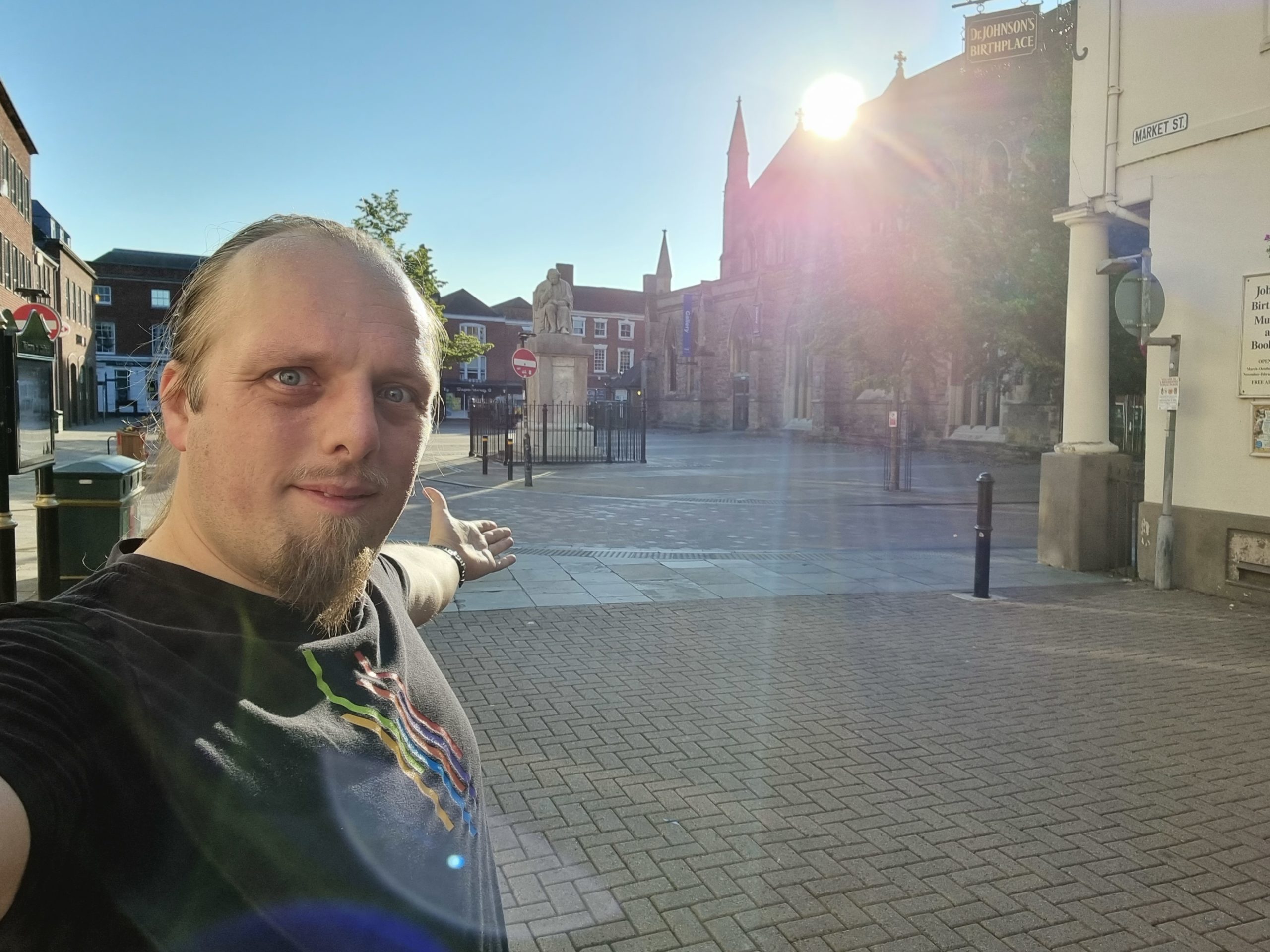 Dan near the corner of the Samuel Johnson Birthplace Museum in Lichfield, in a deserted public square early in the morning.