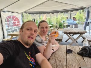 Dan and Ruth enjoy cocktails in a beer garden.