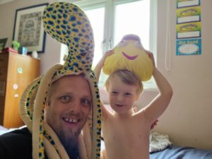 Dan and his 4-year-old wearing silly hats.