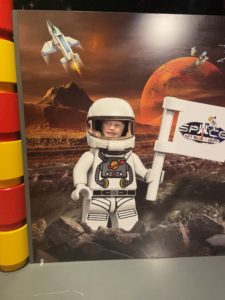 Child in a lego space suit.