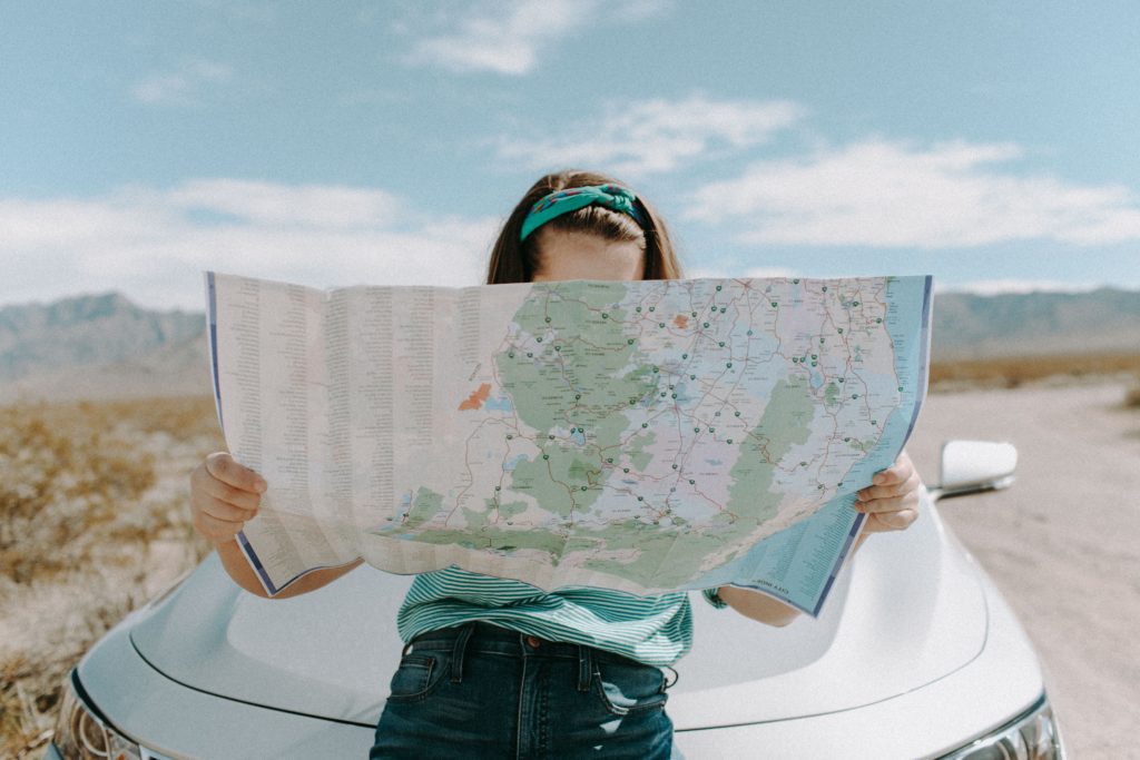 A woman reading a map. Photo by Leah Kelly.