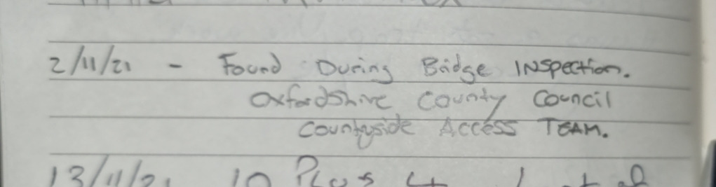 Geocache logbook entry reading: "2/11/21 - Found during bridge inspection. Oxfordshire County Council Countryside Access Team."