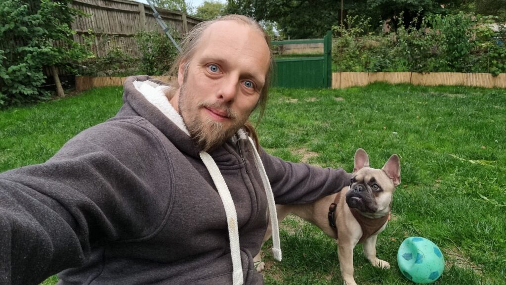 Dan with the dog, in the garden.