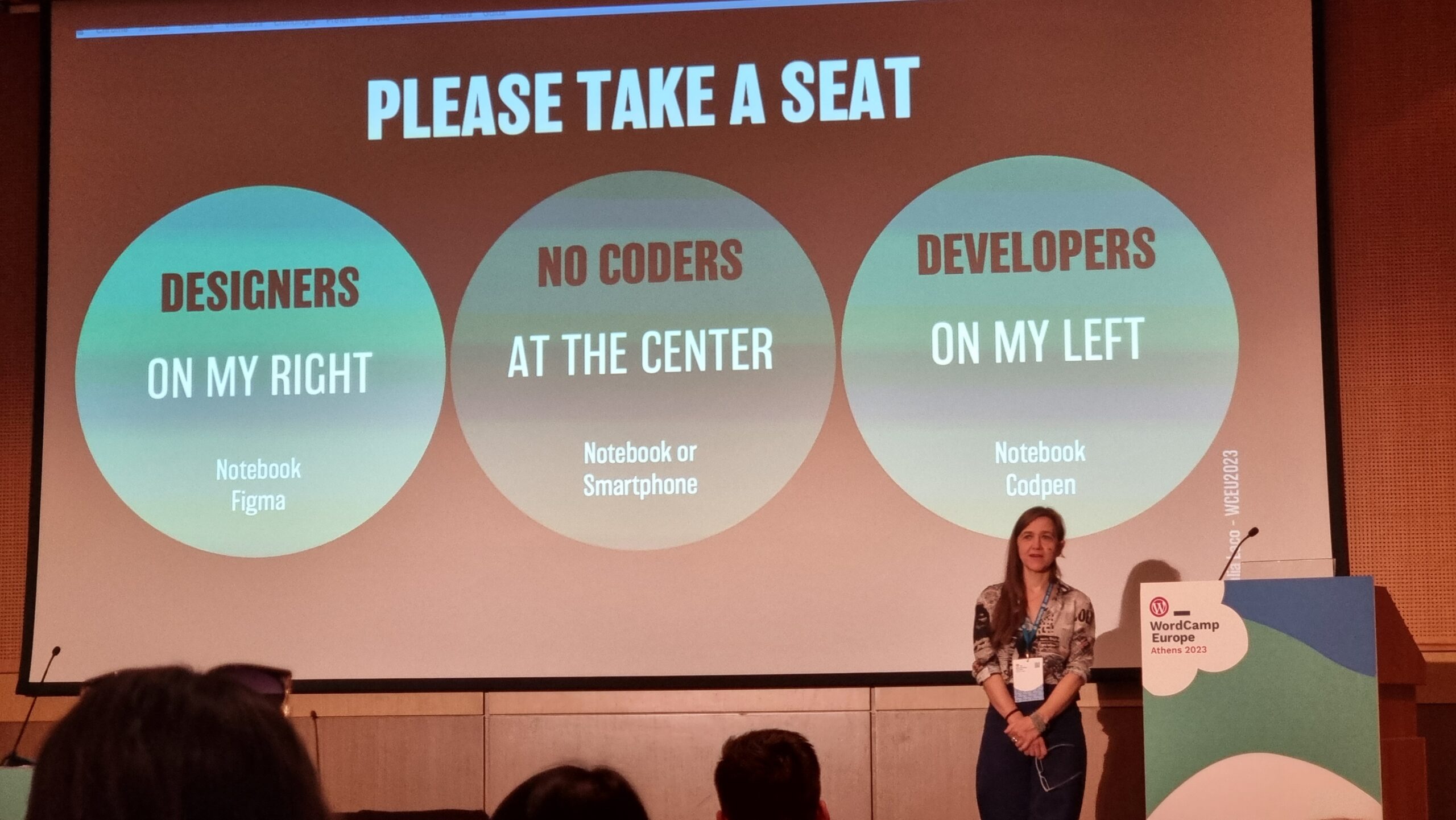 A title slide encourages designers to sit on the left (to the right of the speaker), developers to the right (on her left), and "no-coders" in the centre.