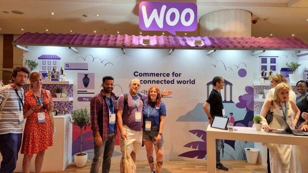 A "Woo" booth, staffed with a variety of people, with Dan at the centre.