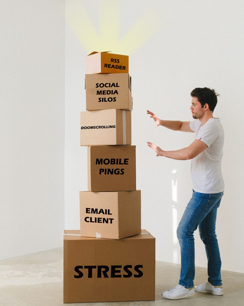 A white man with dark hair, wearing jeans and a t-shirt, moves to push over a stack of carboard boxes, each smaller than the one beneath it. From bottom to top, the boxes are labelled: stress, email client, mobile pings, doomscrolling, social media silos... and the very top, very smallest box, which glows with sunbeams emitted from it, reads "rss reader".