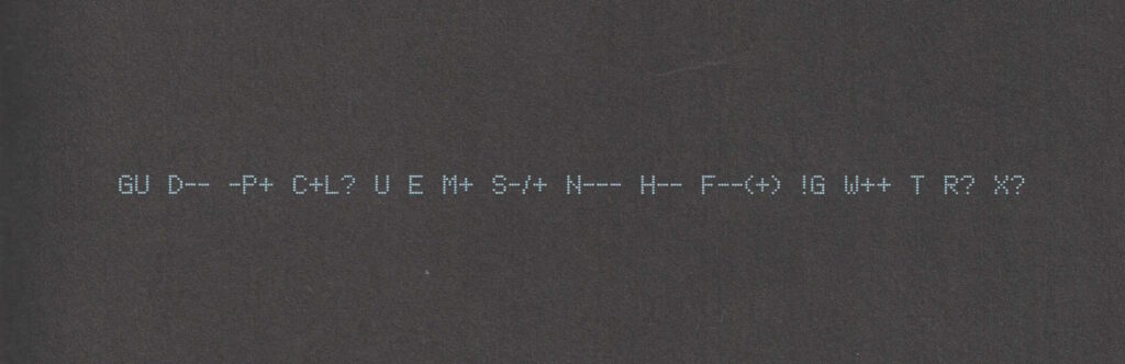 A "Geek Code Block", printed in a dot-matrix style font, light-blue on black, reads: GU D-- -P+ C+L? U E M+ S-/+ N--- H-- F--(+) !G W++ T R? X?