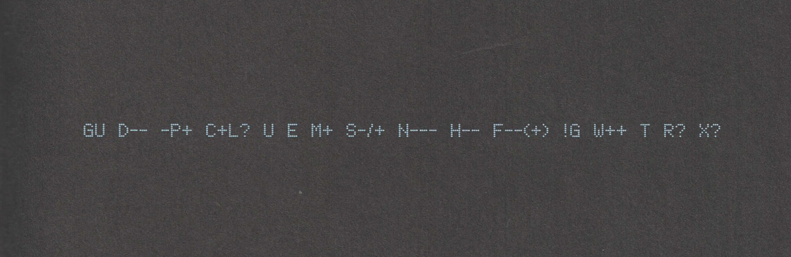 A "Geek Code Block", printed in a dot-matrix style font, light-blue on black, reads: GU D-- -P+ C+L? U E M+ S-/+ N--- H-- F--(+) !G W++ T R? X?