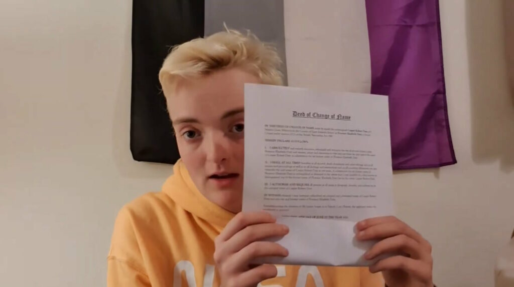 Screengrab from a video in which a vlogger holds up their freedeedpoll.org.uk deed poll.
