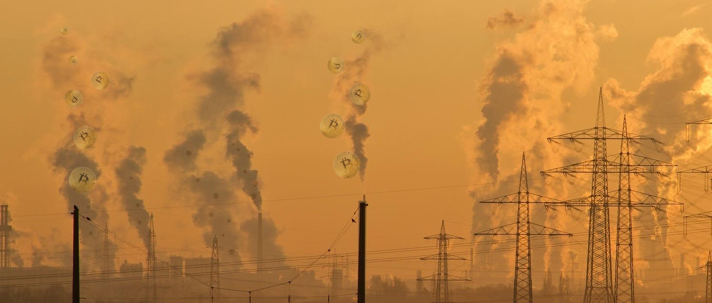 Industrial sprawl at sunset: countless tall chimneys belch smoke alongside crisscrossing power lines. In the smoke, the outline of "physical" Bitcoins can be seen.