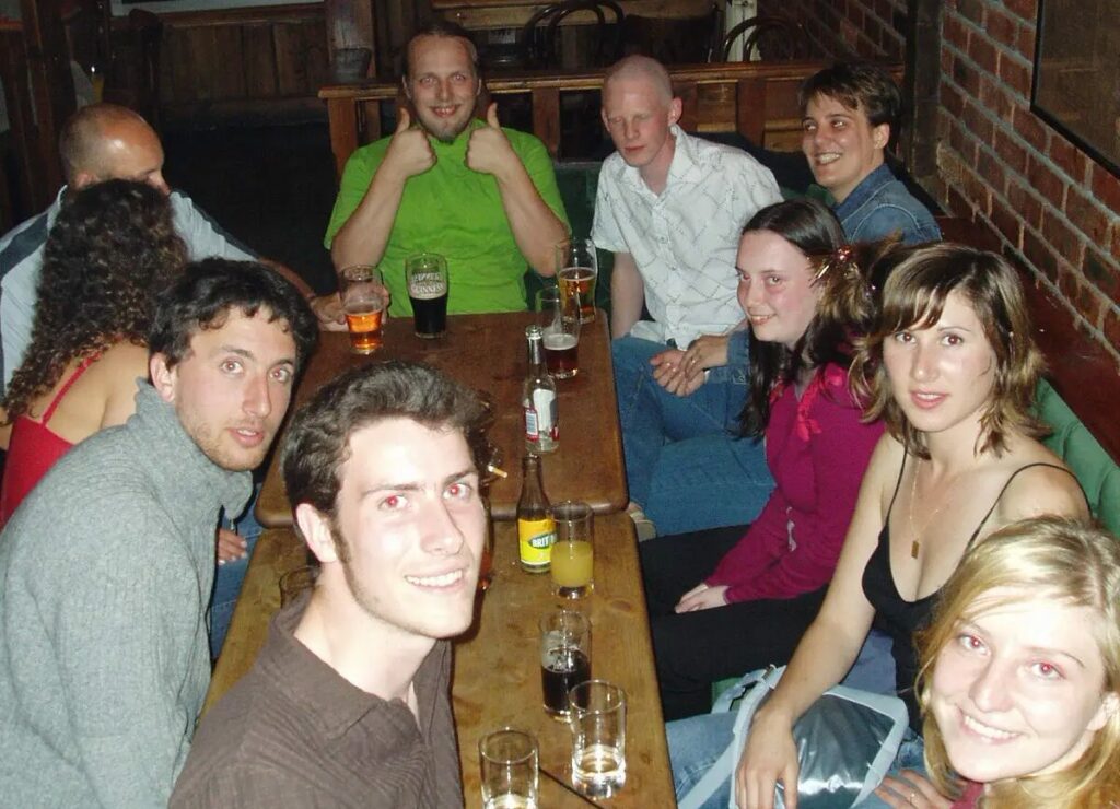 Dan with coworkers and friends drinking in a pub.