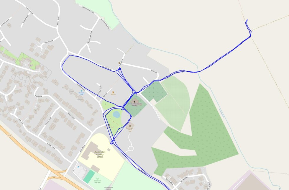 Map showing a walk around Ducklington, including out to near a field to the East and back.