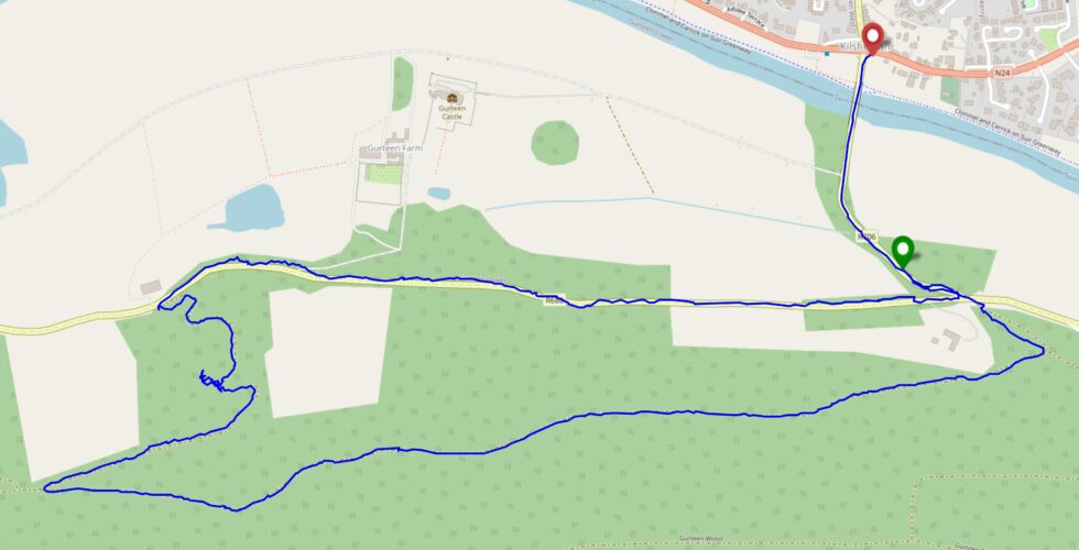 Map showing a walking route from Kilsheelan, over a bridge to the South, up into and around the forest, and back again.