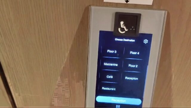 Touchscreen interface for operating a smart lift, housed in the lobby.