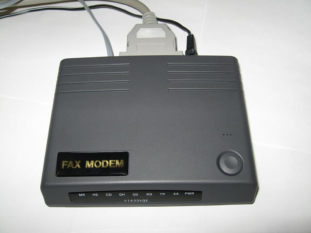 An xternal 33.6kbps serial port dial-up modem.