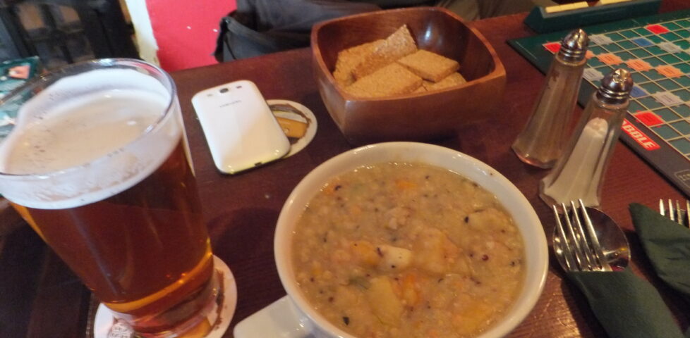 (Veggie) haggis stovie (in a mug), a bowl of oatcakes, and a pint of beer.